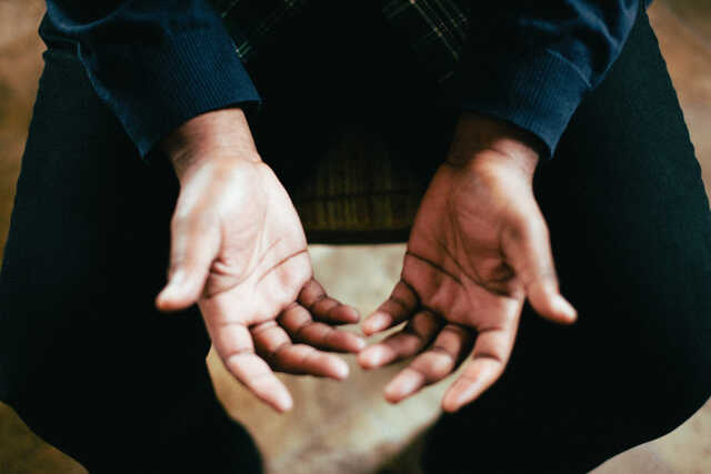 hands open in prayer