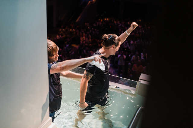 man celebrating after being baptized