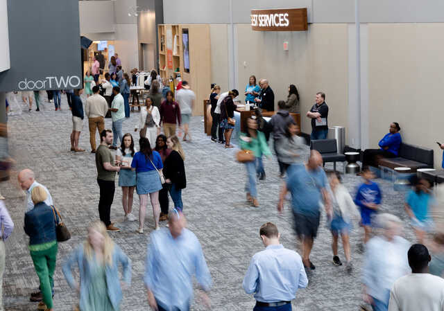an overhead view of the busy lobby at buckhead church during a sunday