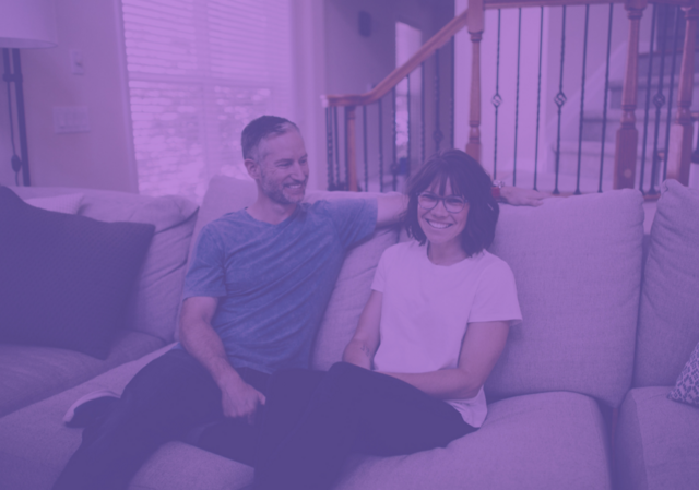 purple image of couple talking on a couch